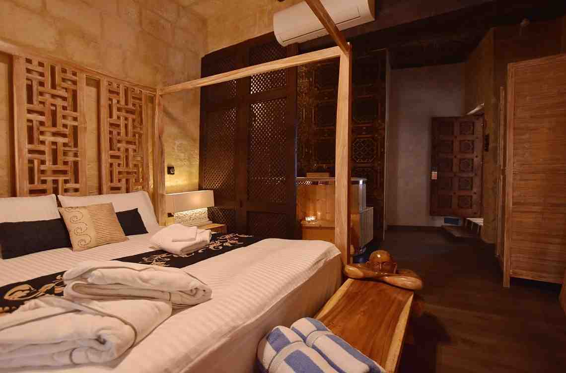 Bed frame and bench creation by baliartfurniture for 5 suite resort in Malta